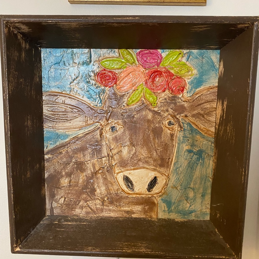 Art- folkish piece of a colorful cow
